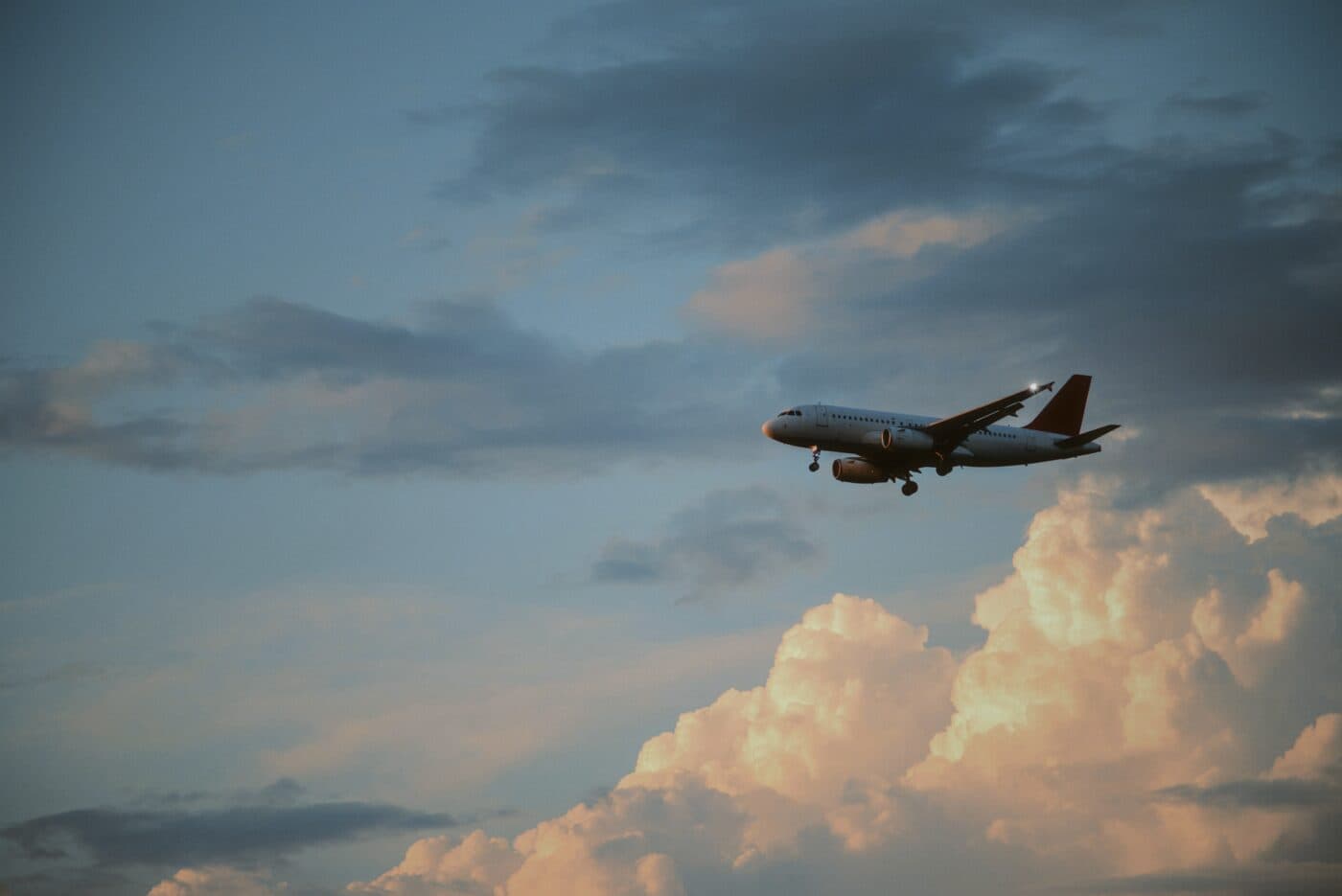 Airplane wing over city